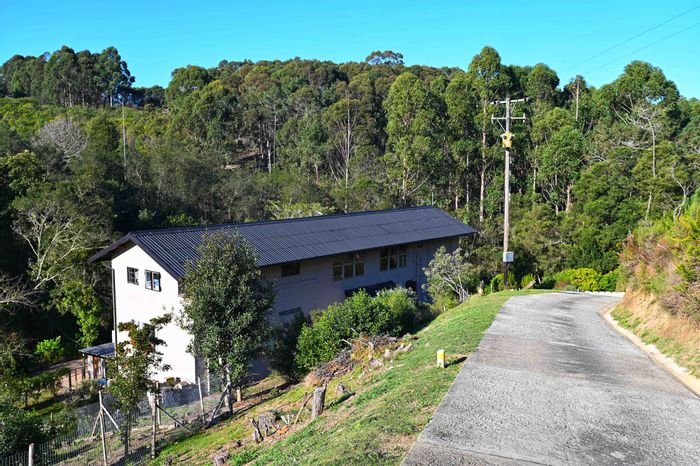 Hoekwil Small Holding For Sale: Multiple dwellings, forest views, and usable land.