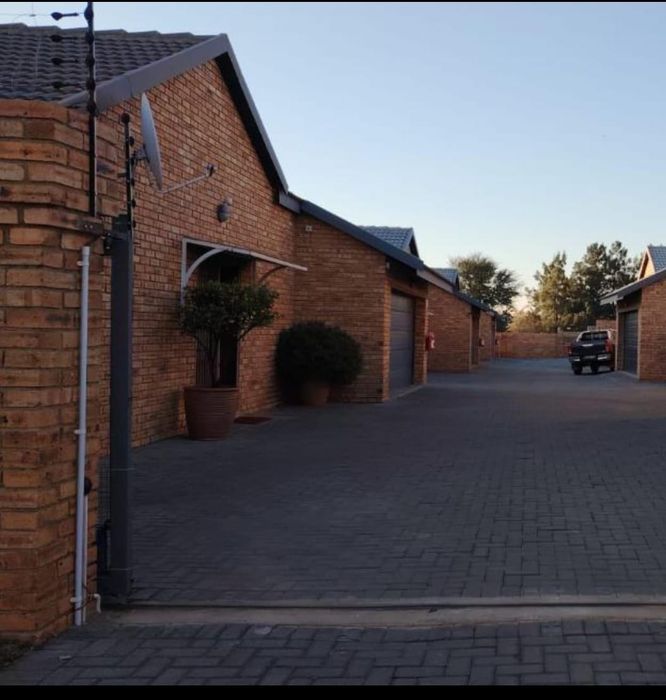 For Sale: House in Vaalpark with 3 beds, double garage, and private yard.
