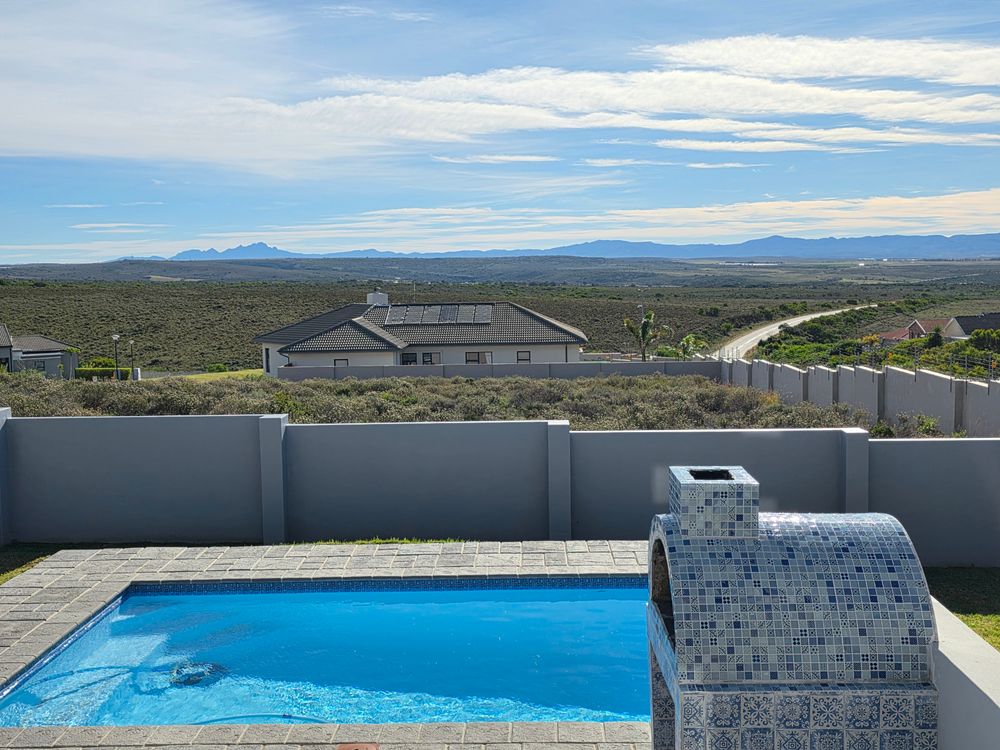 Exterior braai & pizza oven at poolside