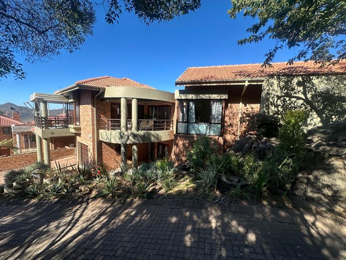 House for Sale in Steiltes: Family home with flatlet, patios, and mountain views.