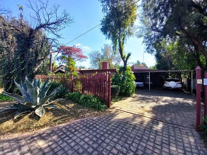 Rustenburg Central House For Sale: Spacious home with double garage, garden, and lapa.