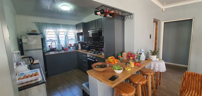 George South House For Sale: Renovated 2-bed, open layout, covered parking, spacious yard.