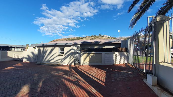 For Sale: 3-Bedroom Townhouse in Mossel Bay Central with private patio and garage.