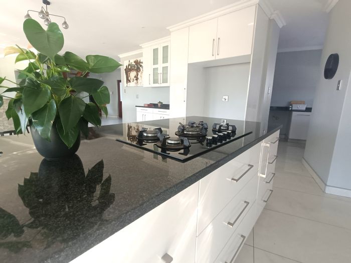 For Sale: House in Mzingazi Golf Estate with pool, patio, and golf views.