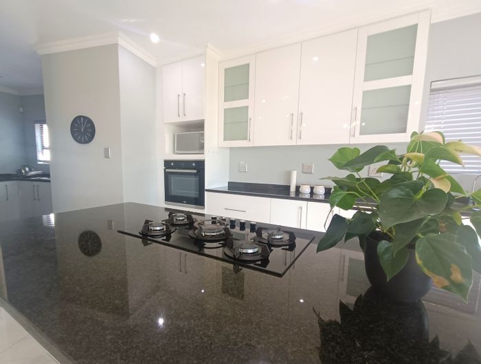 House To Rent in Mzingazi Golf Estate: 4 bedrooms, air-conditioning, open-plan living.