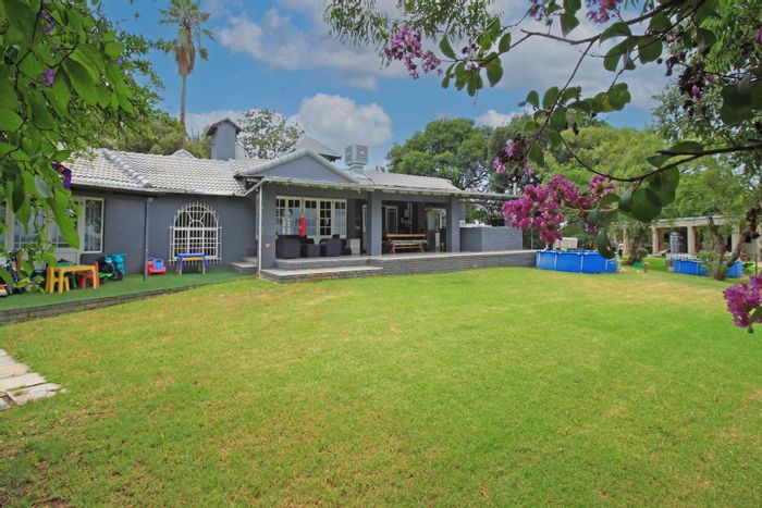 Spacious Sun Valley house with stables, cottages, and extensive outdoor amenities for sale.