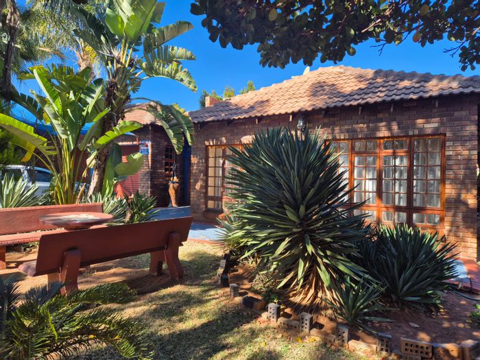 For Sale: Spacious 4-bedroom house in Flora Park with double garage and yard.