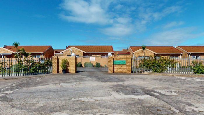 3-Bedroom Townhouse To Rent in South End, secure complex with private garden.