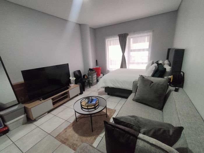 Flat for Sale in Pretoria North: 1 Bedroom, Rooftop Braai, Secure Access.