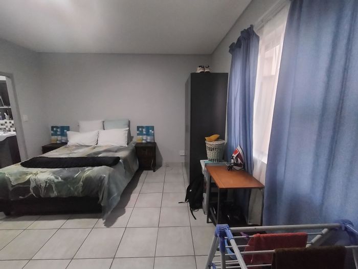 For Sale: Apartment in Pretoria North with secure parking and rooftop braai facilities.