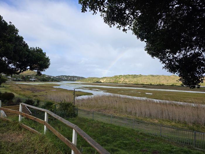 For Sale: House in The Village with indoor pool, study, and lagoon views.