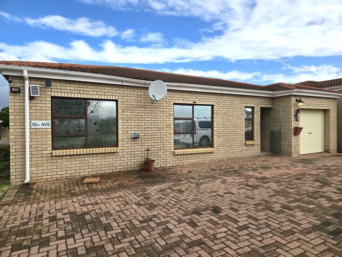 Townhouse for Sale in Jeffreys Bay Central: Secure living, garage, outdoor braai area.