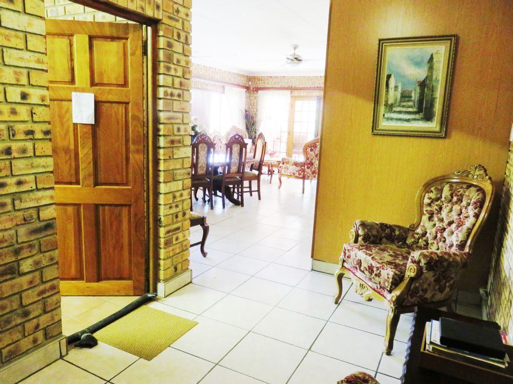 Entrance hall & internal access from garage to left