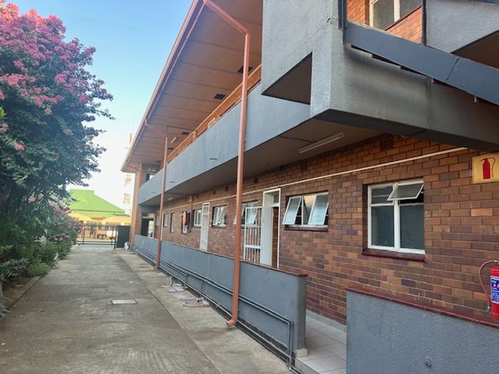 1-Bedroom Apartment To Rent in Rustenburg Central with parking and convenient amenities.