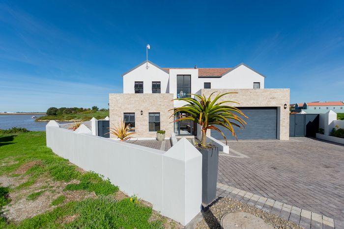 For Sale: House in Port Owen with jetty, 4 bedrooms, open-plan living.