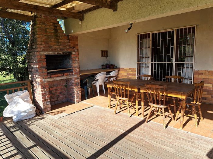 Kwelera Farm For Sale: Productive land, spacious farmhouse, ample storage, and parking.