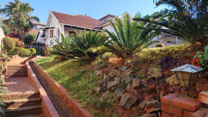 Essenwood House For Sale: Renovation opportunity with income-generating apartments and pool.