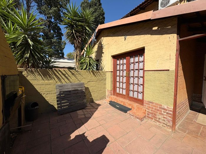 Rustenburg Central Apartment For Sale: 2 bedrooms, large lounge, enclosed patio, prime location.