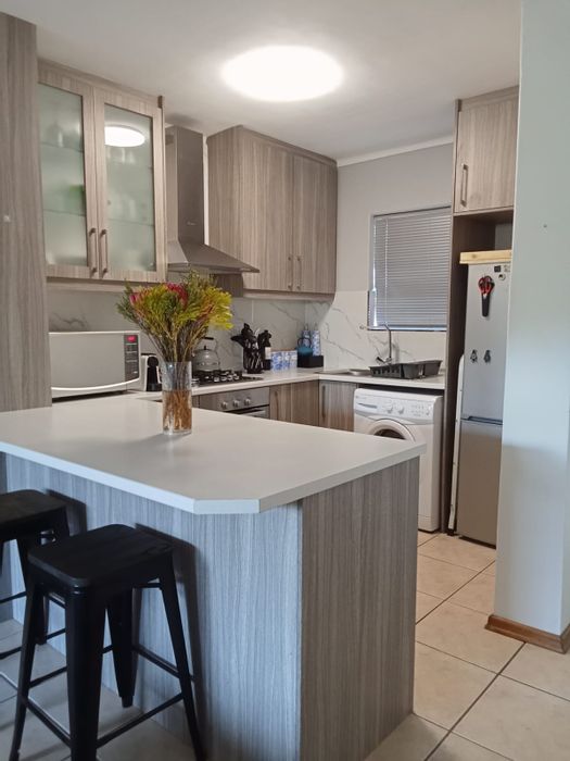 2-Bedroom Apartment To Rent in Table View with private garden and parking.