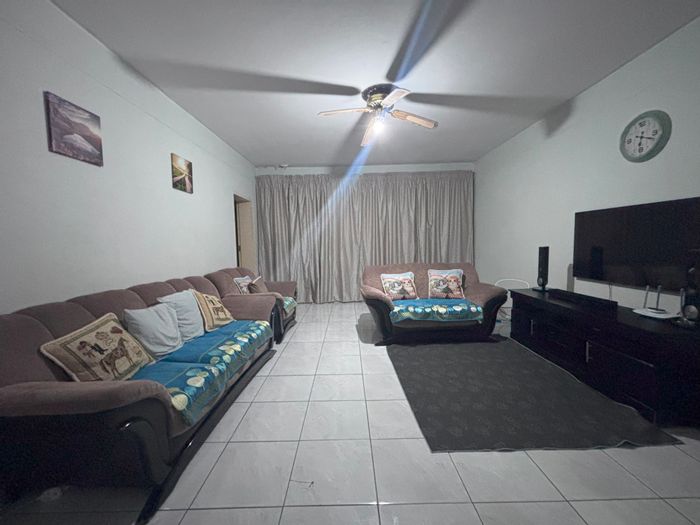 Spacious 3-bedroom apartment in Sunnyside with secure garage, for sale now.
