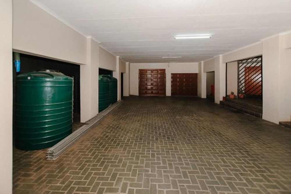 Carport with garages & water tank