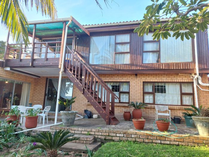 House for Sale in Christmas Rock: 4 bedrooms, garden, deck, and entertainment areas.