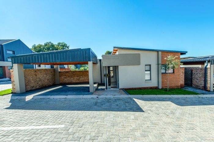 For Sale: Carlswald Townhouse with private garden, double carport, and community amenities.