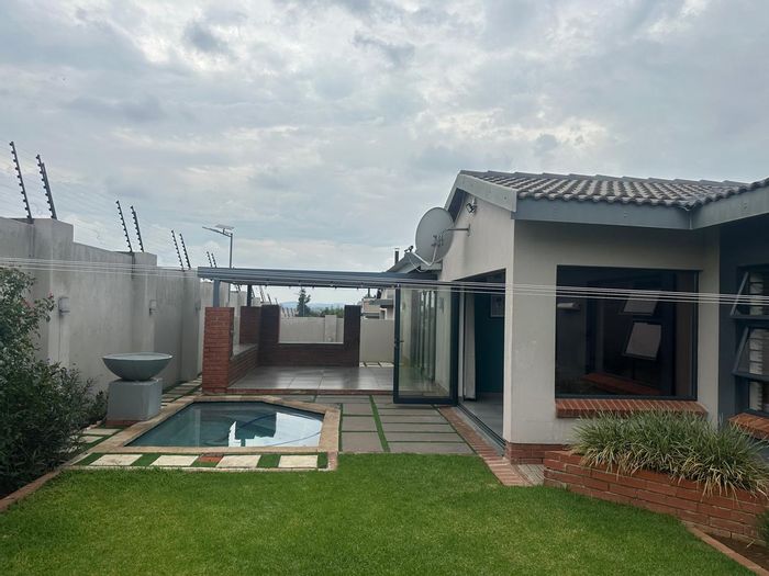 For Sale: 3-Bedroom Townhouse in Waterkloof AH with pool, garden, and security.