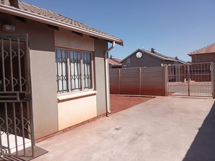 For Sale: 2-Bedroom House in Sky City with yard, parking, and community access.