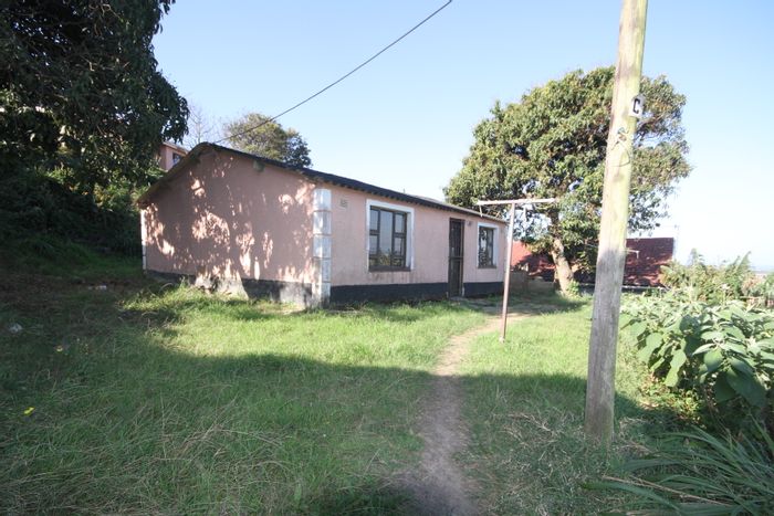 Umlazi N House For Sale: 2 Bedrooms, 1 Bathroom, Renovation Opportunity, Close to Amenities.