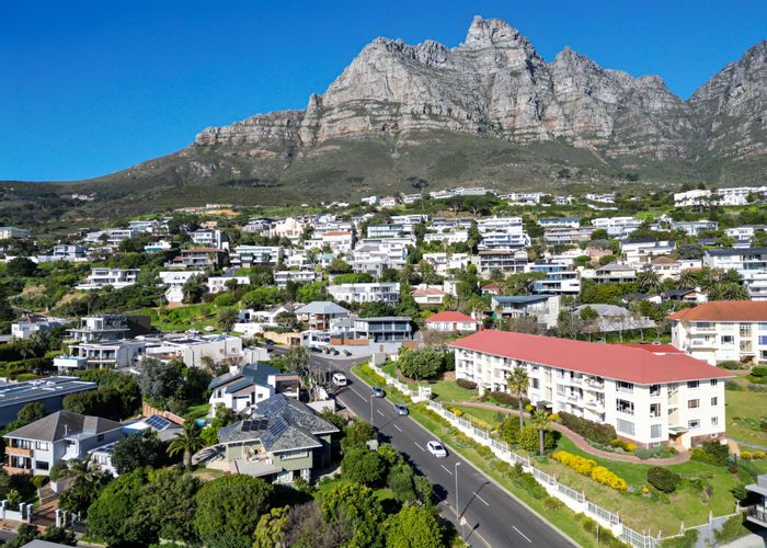 Camps Bay Apartment For Sale: Panoramic views, dual baths, secure building, double garage.