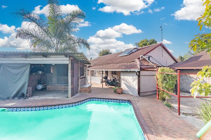 For Sale: Dan Pienaarville House with multiple rental units, pool, and workshop.