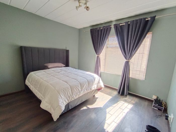 For Sale: Ground floor townhouse in Zwartkop with garden, pool, and secure parking.