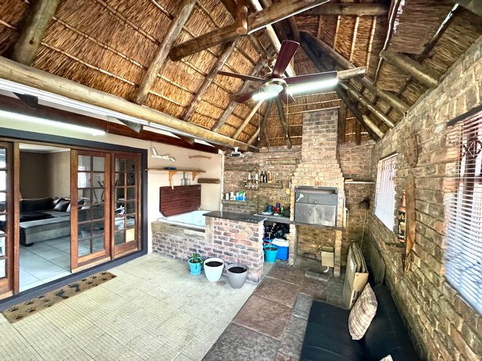 House for Sale in Sunset Park: Indoor entertainment area, solar-powered amenities, and spacious living.