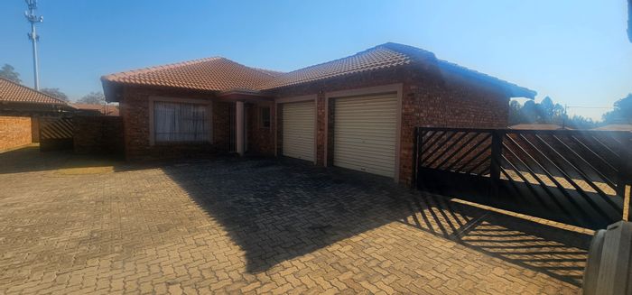 For Sale: Townhouse in New State Areas with 3 beds, double garage, and outdoor space.