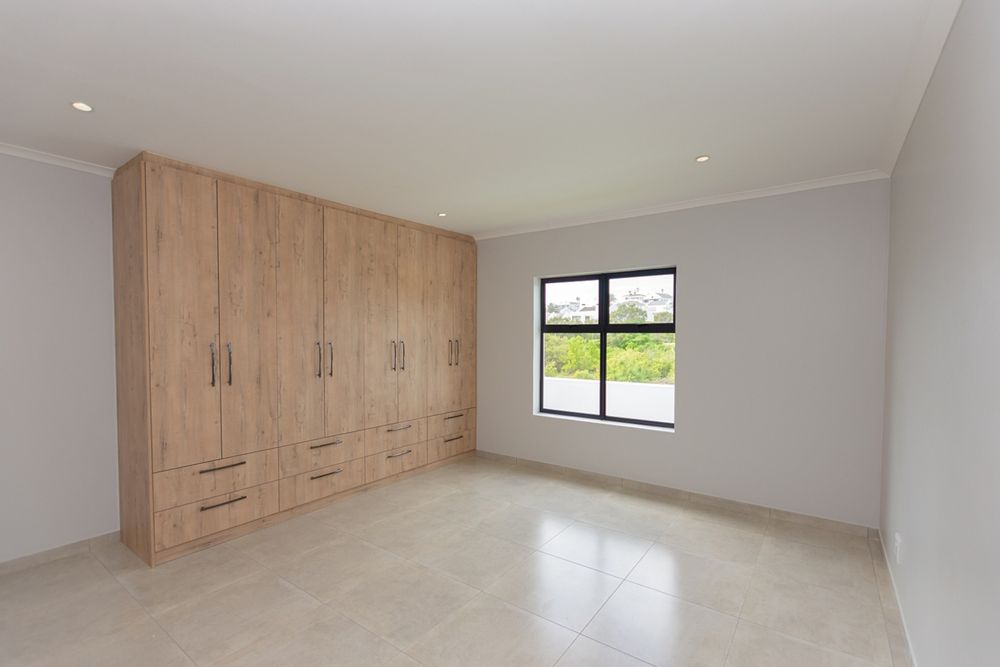 Ample cupboards in main bedroom