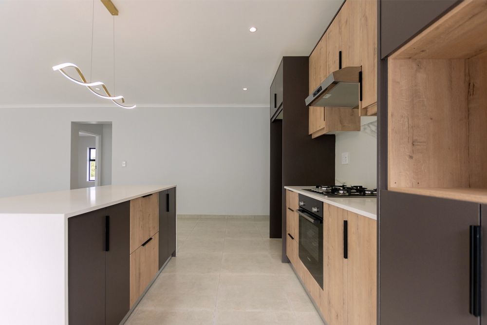 Side view of kitchen with gas stove