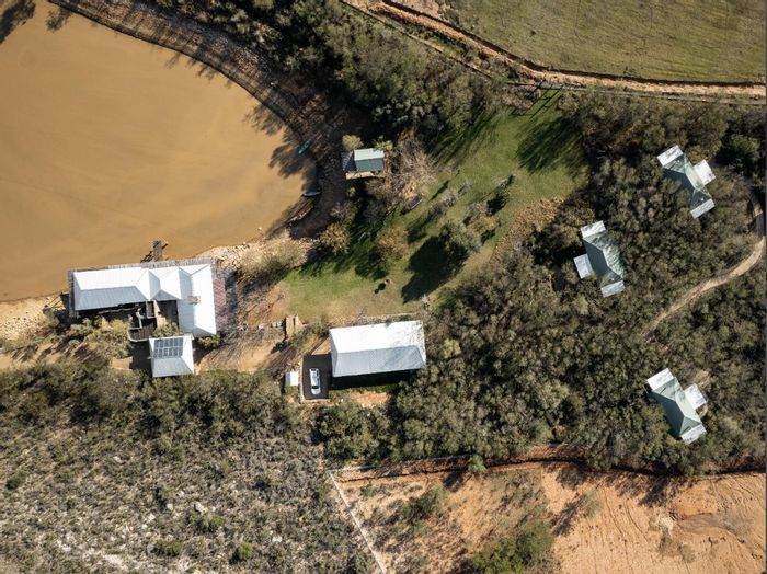 For Sale: Oudtshoorn Rural Farm with luxury cottages, sustainable features, and working operations.