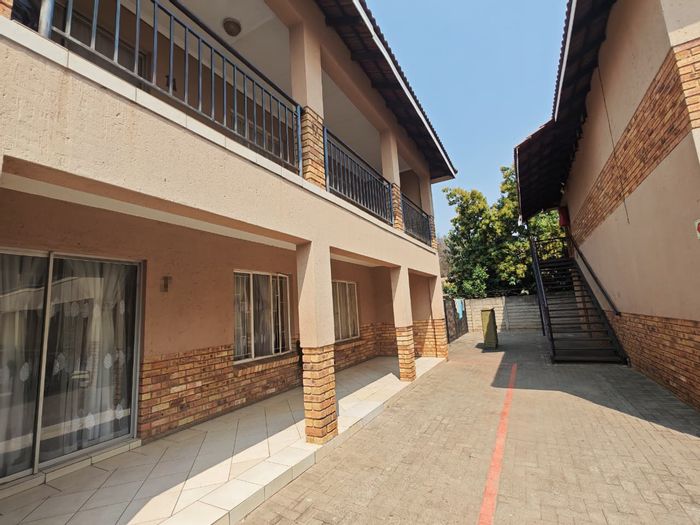 For Sale: 2-Bedroom Apartment in Rustenburg Central with Garage and Parking.