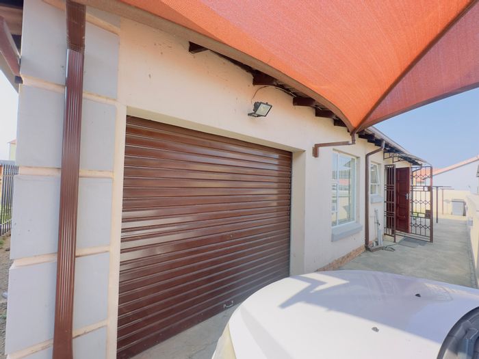 For Sale: House in Sharon Park with 3 bedrooms, garage, and outdoor boma.