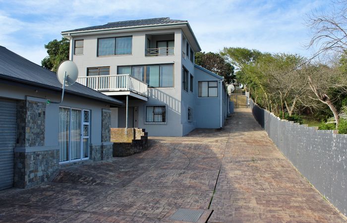 East Bank House For Sale: Scenic views, multiple flats, spacious deck, pet-friendly garden.