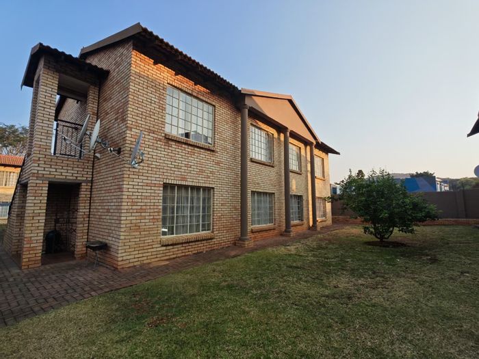 2-Bedroom Apartment For Sale in Waterval East with outdoor access and covered parking.
