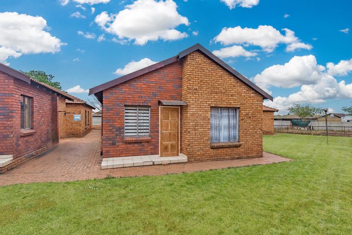 For Sale: 2-bedroom house in Protea Glen with security, parking, and amenities nearby.