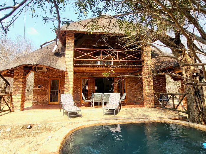 House for Sale in Marloth Park Central: 2 beds, pool, wildlife views, 5000L water tank.