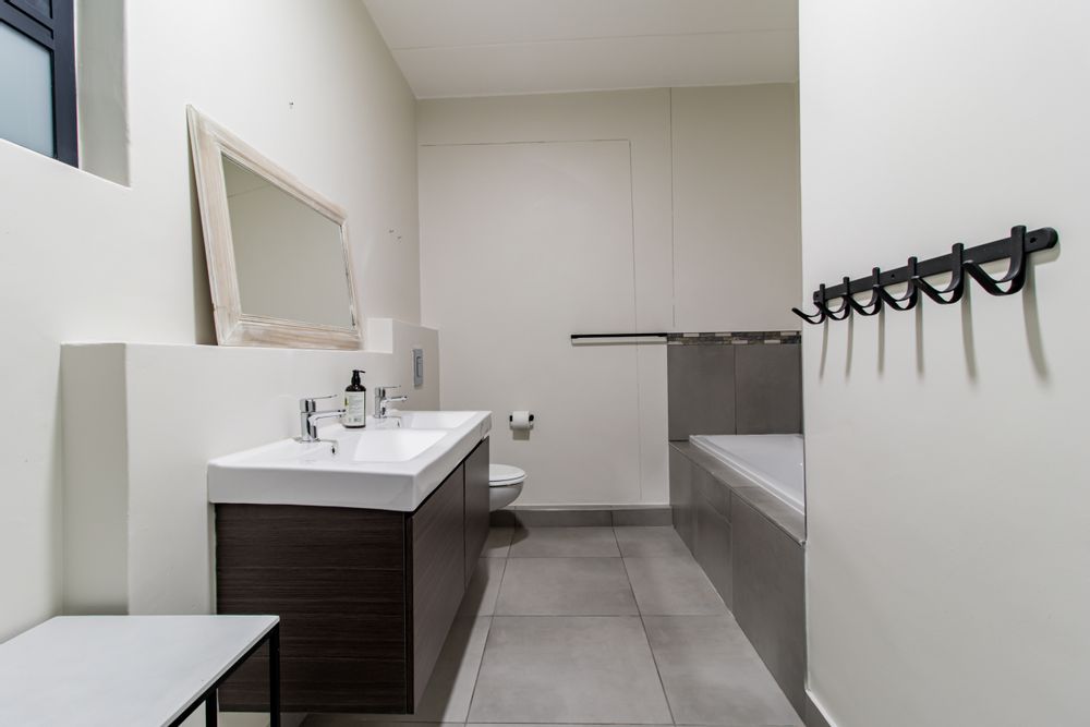 Bathroom features double vanity.