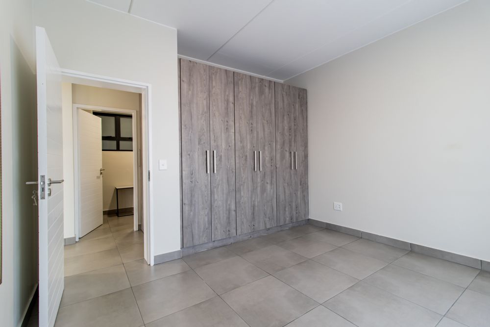 Main bedroom with build-in cabinetry.
