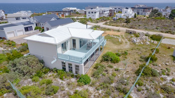 For Sale: House in Pringle Bay Central with ocean views, decks, and flatlets.