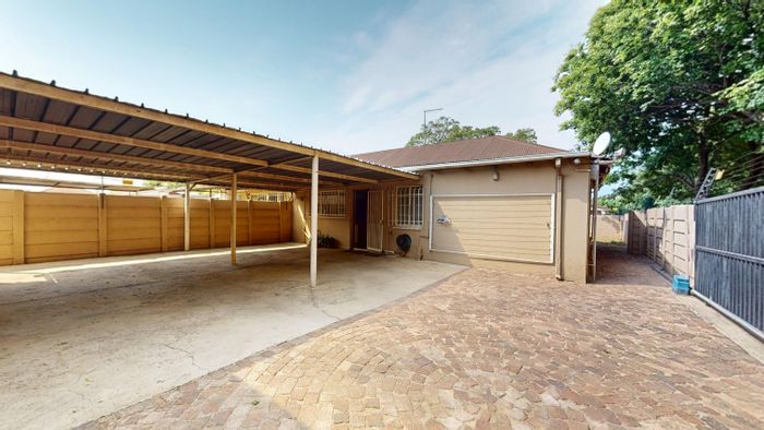 Versatile Boksburg North house for sale: two semi-homes, parking, gardens.