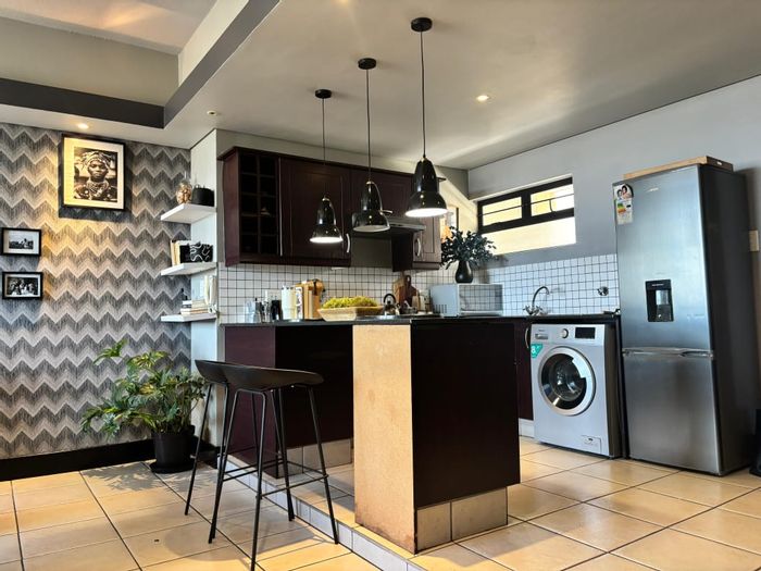 For Sale: Apartment in Ferreirasdorp with 2 beds, balcony, and secure parking.