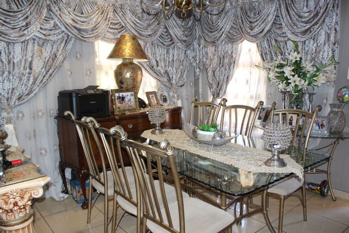 For Sale: House in Roodepoort North with 3 bedrooms, double garage, and outbuildings.